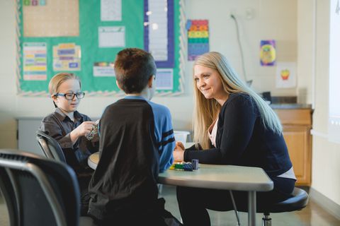Jade assisting students