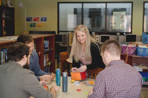 Jade in the library assisting students