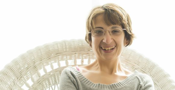 Woman in chair smiling