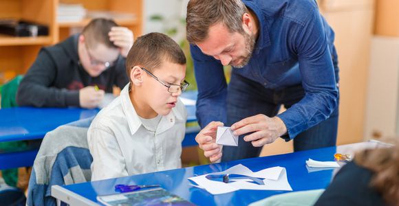 Male teacher with male student